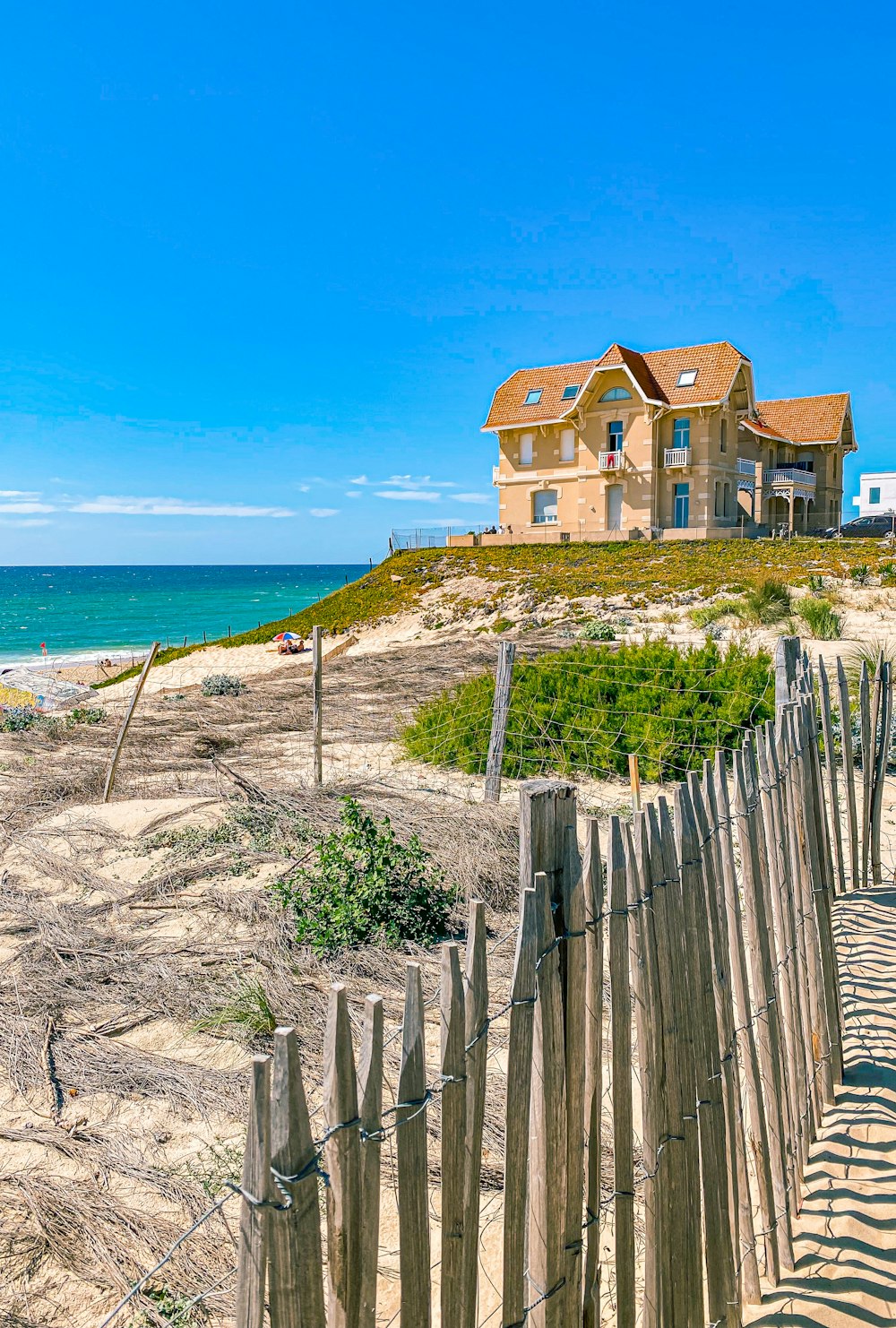 a house on a hill by the ocean