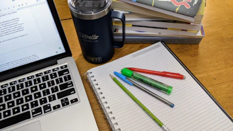 a laptop and a cup of coffee