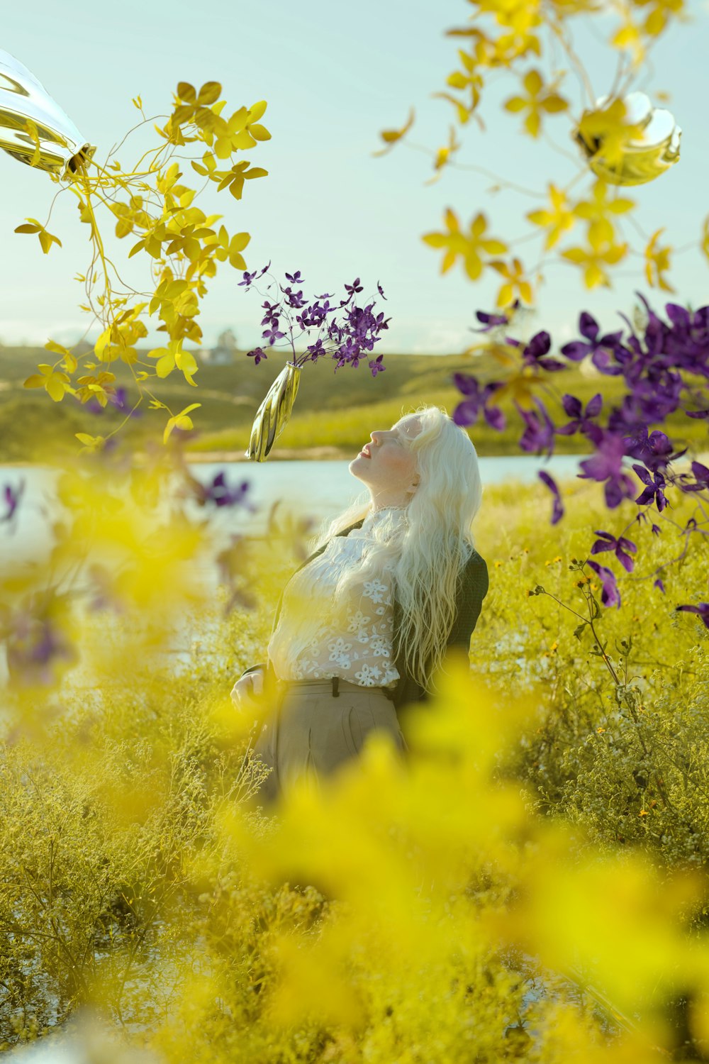 a person standing in a field of flowers