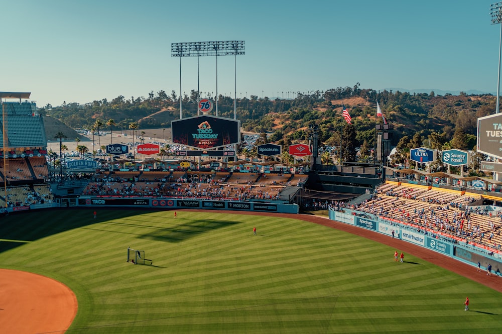 a baseball field with a crowd watching