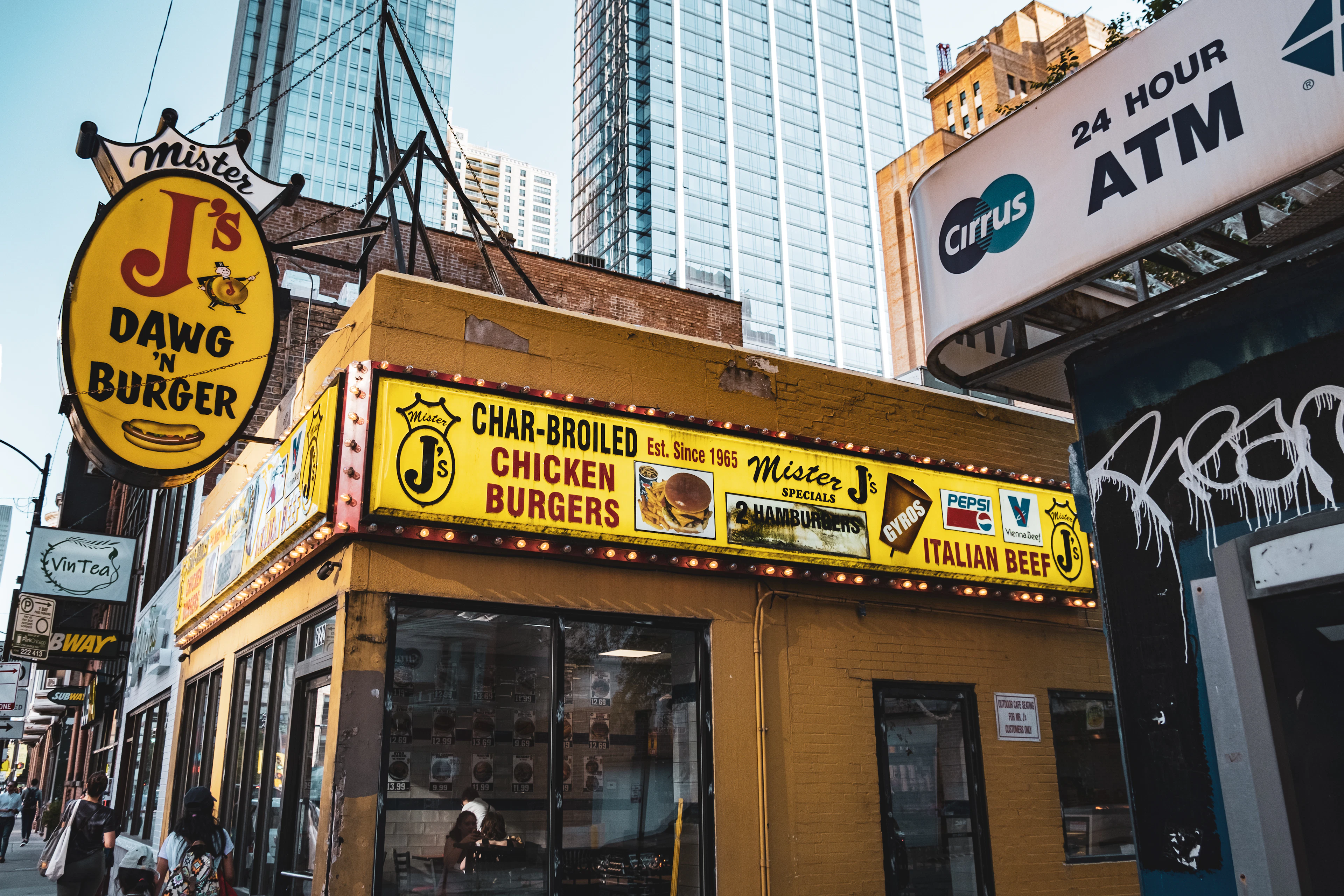 Mister J's storefront advertises char-broiled chicken, Italian beef and burgers on a Chicago street corner.