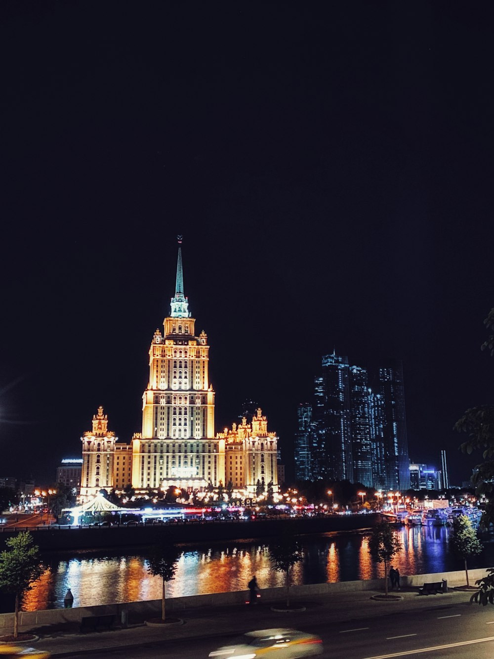 The Bund with a river and a bridge at night