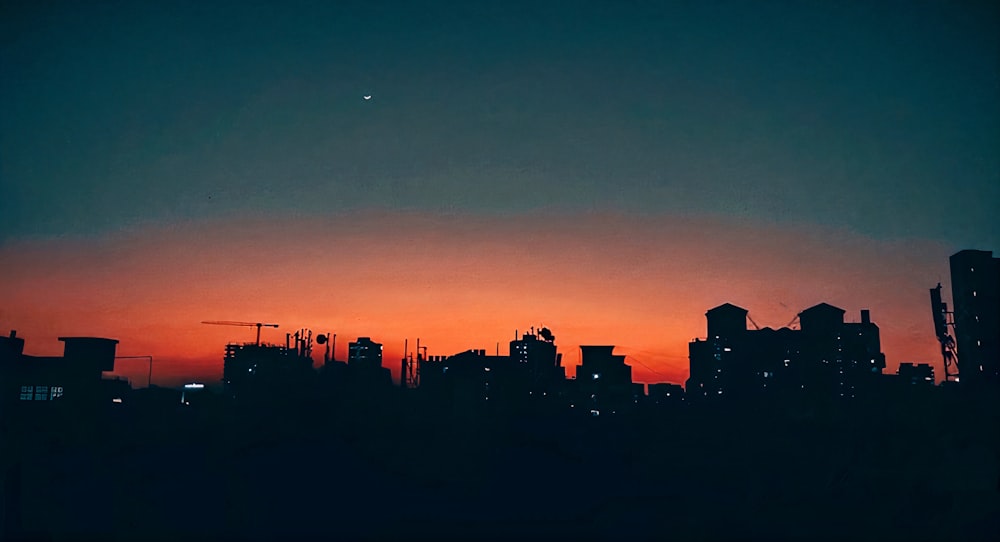 a city skyline at sunset