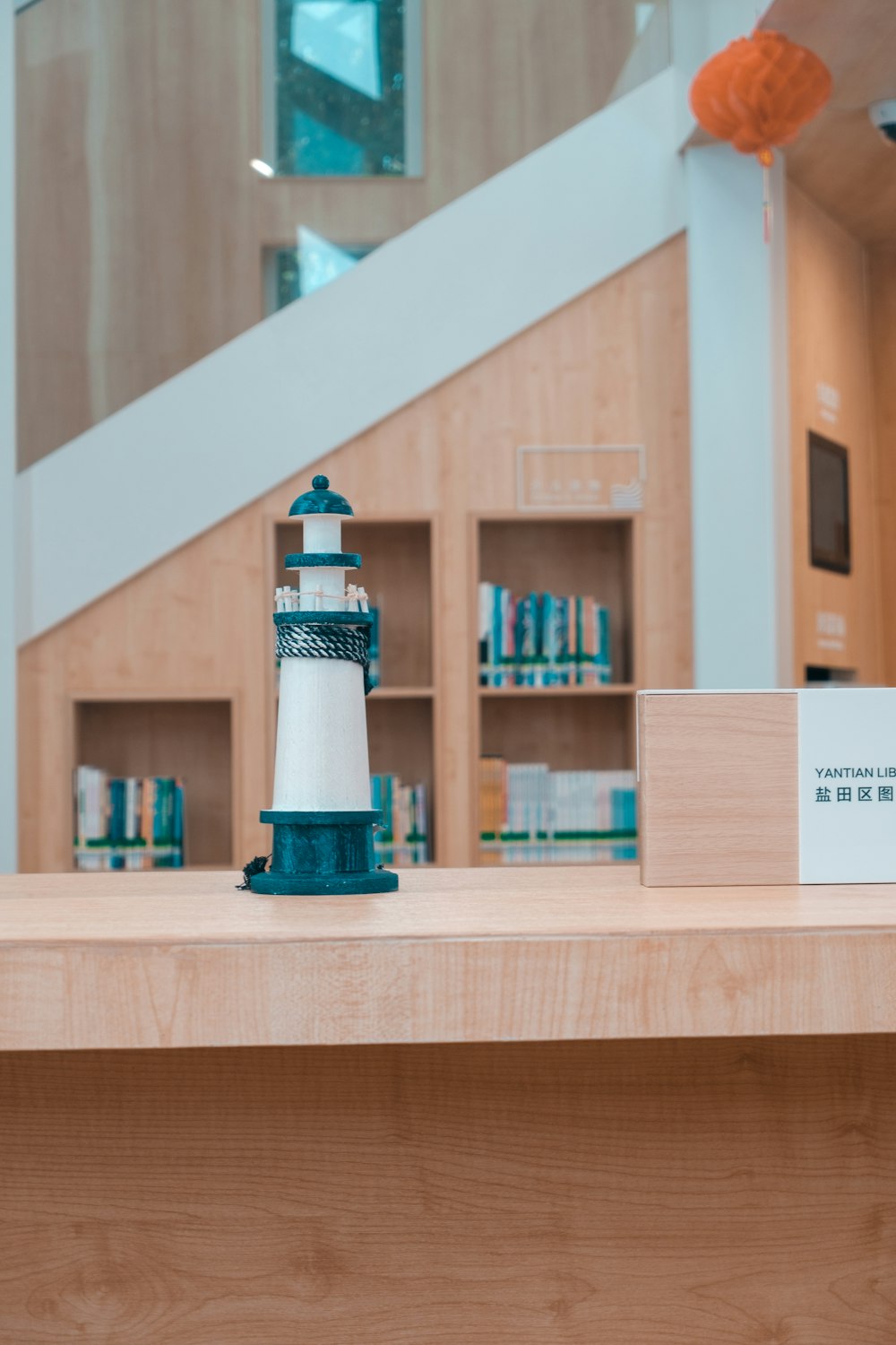 a wooden shelf with a blue and white object on it