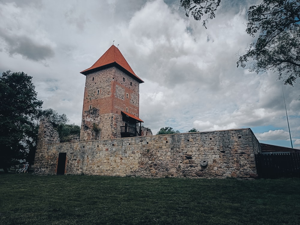 a stone wall with a tower