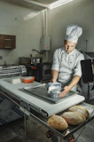 a chef making bread in a kitchen