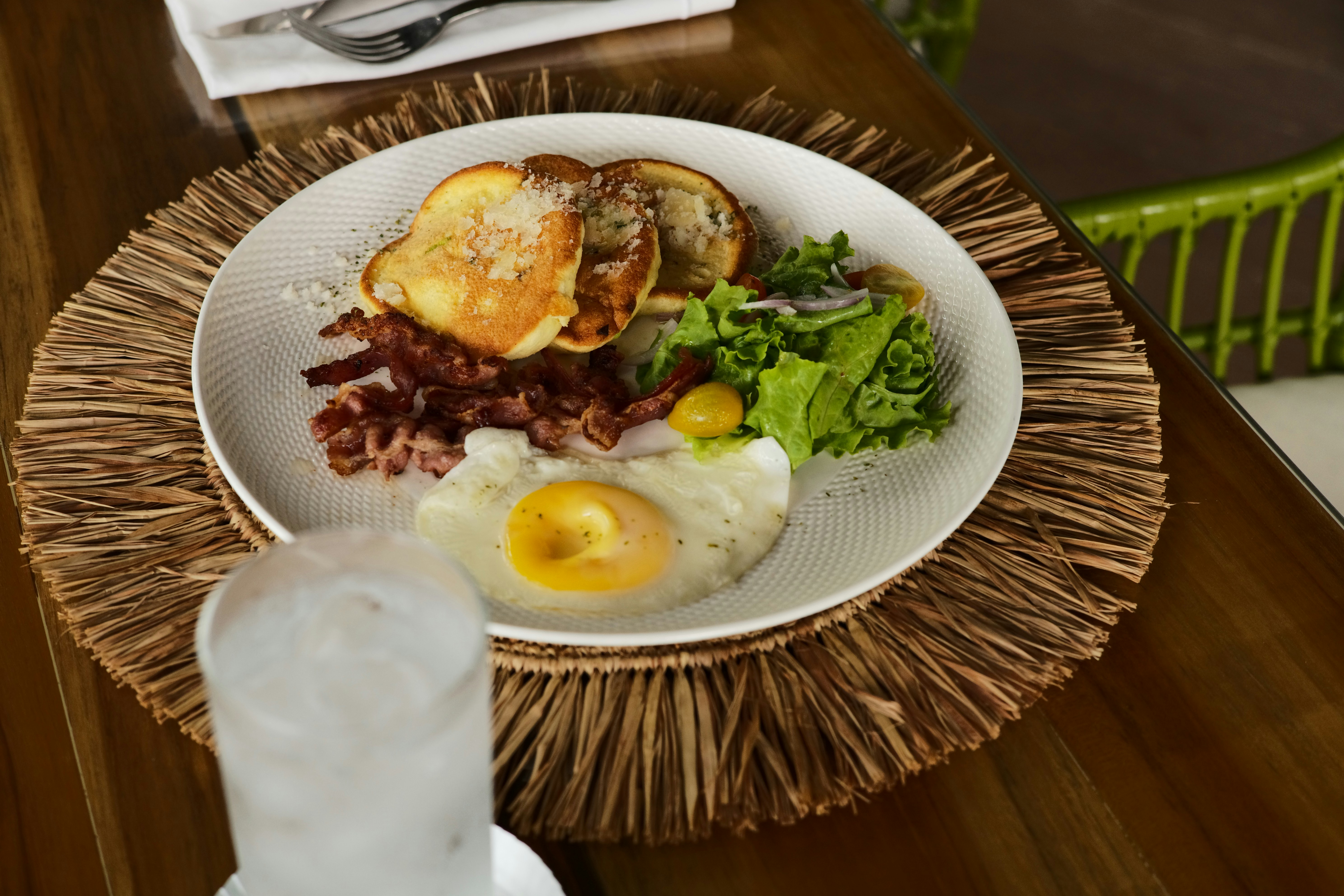 A classic Pad Thai dish wrapped in an egg nest, ready to be enjoyed - thai food menu