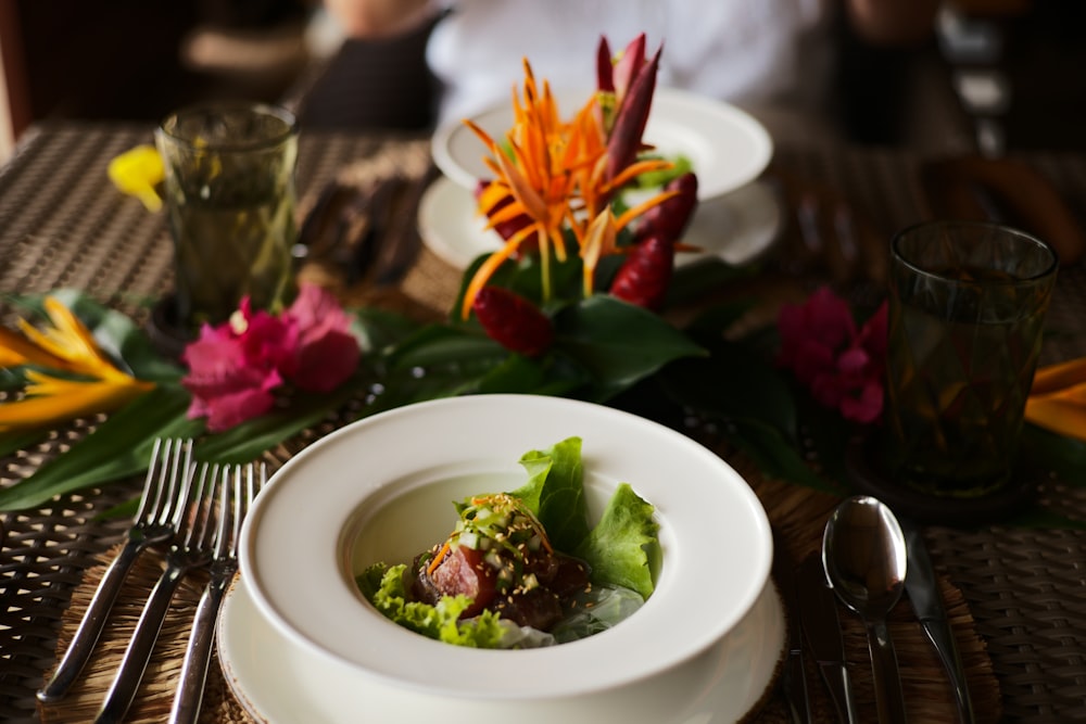 a bowl of soup with flowers