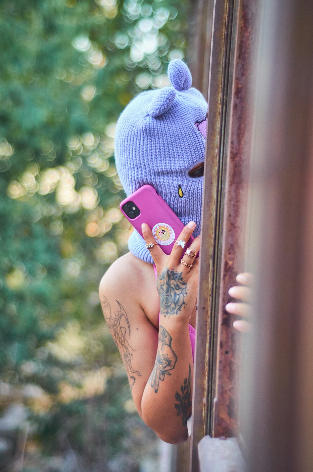 a person in a garment holding a cell phone