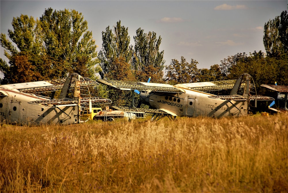 a group of airplanes in a field