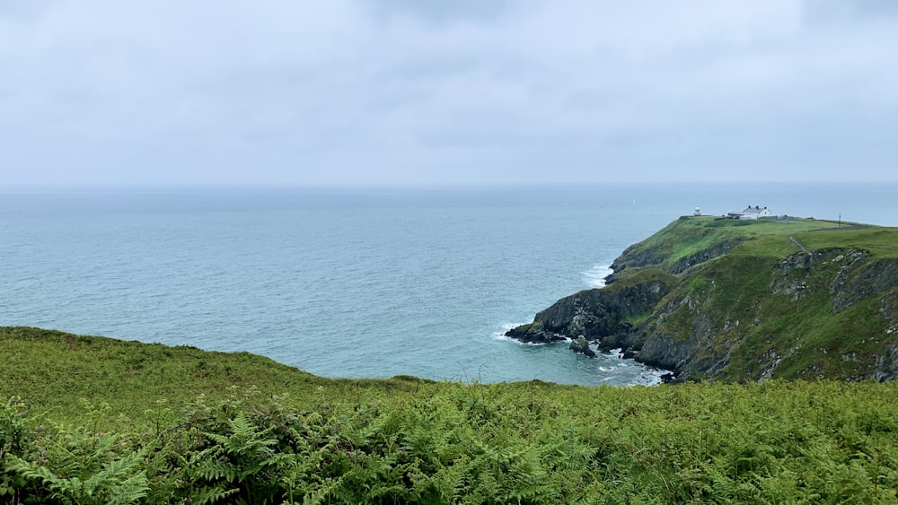 a body of water with hills and trees around it