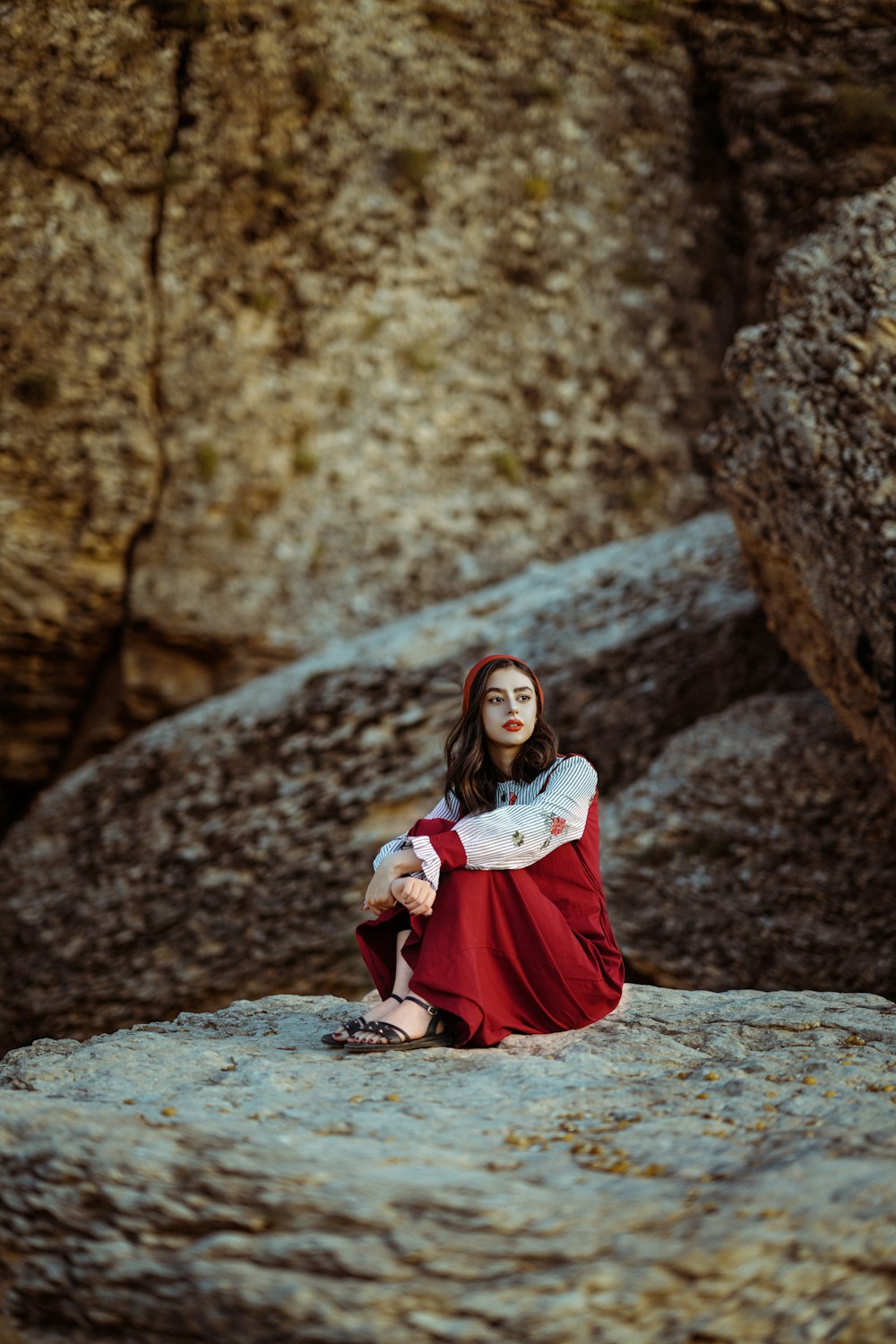 a person sitting on a rock