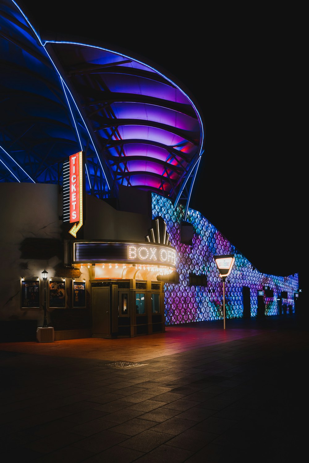 a building with a large neon sign