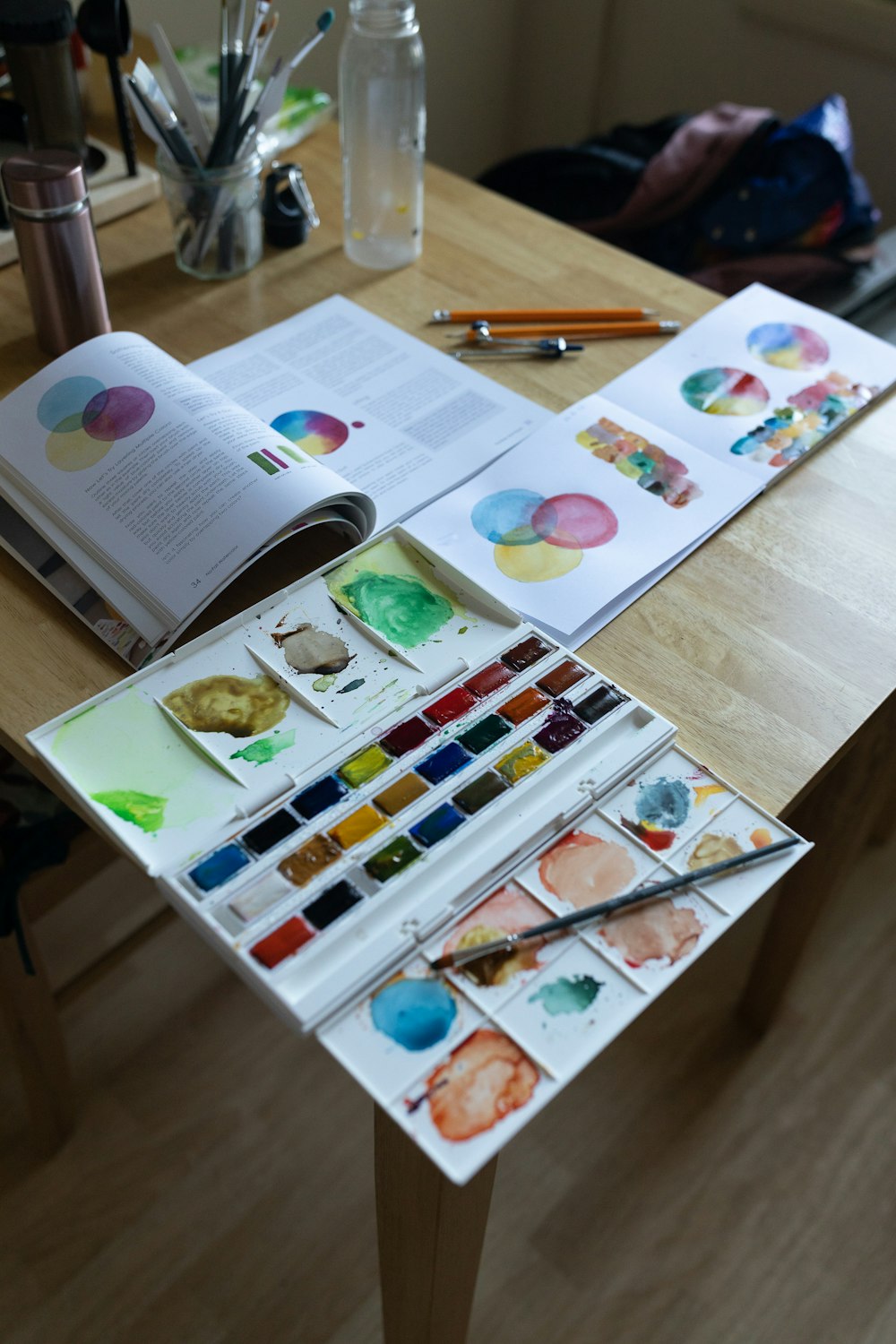 a table with a book and a pen on it