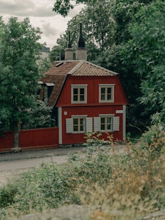 a house with bushes in front of a building