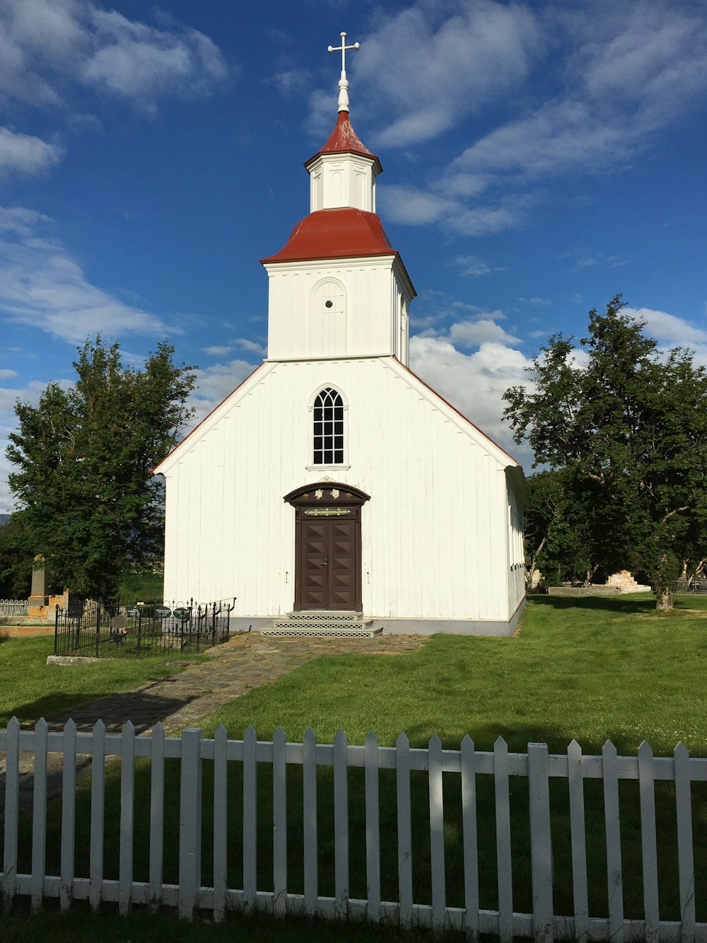 a white church with a red roof