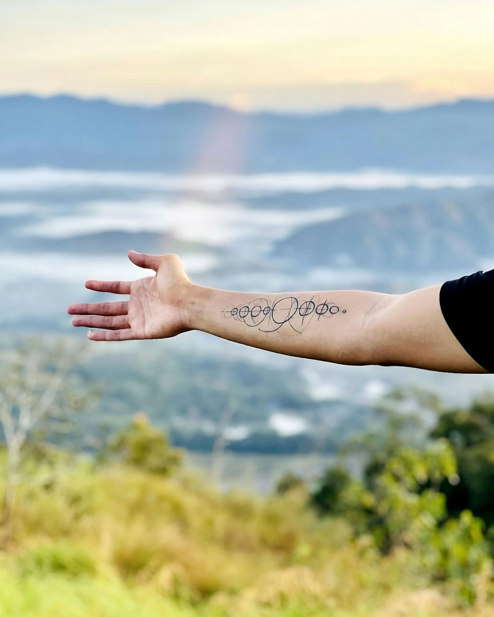 a hand with a tattoo on it