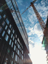 Exterior view of a commercial building under construction on a sunny day