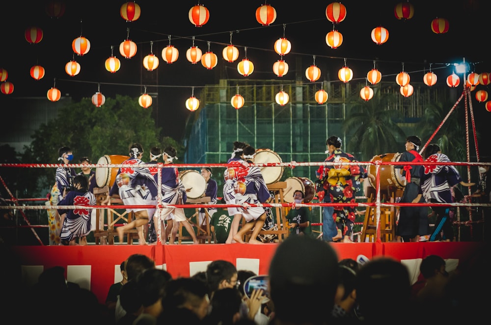 a group of people performing on a stage