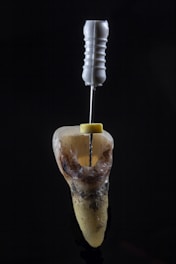 a spoon with a liquid in it