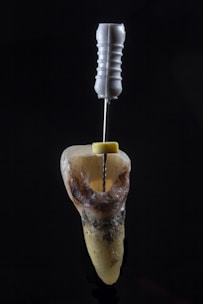 a spoon with a liquid in it