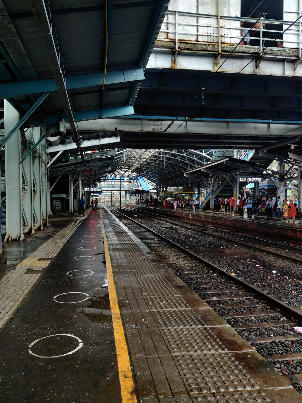 a train station with people waiting