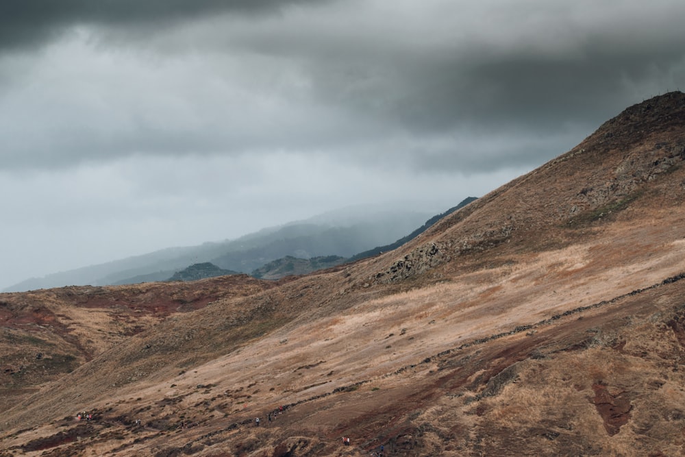 a landscape with hills and clouds