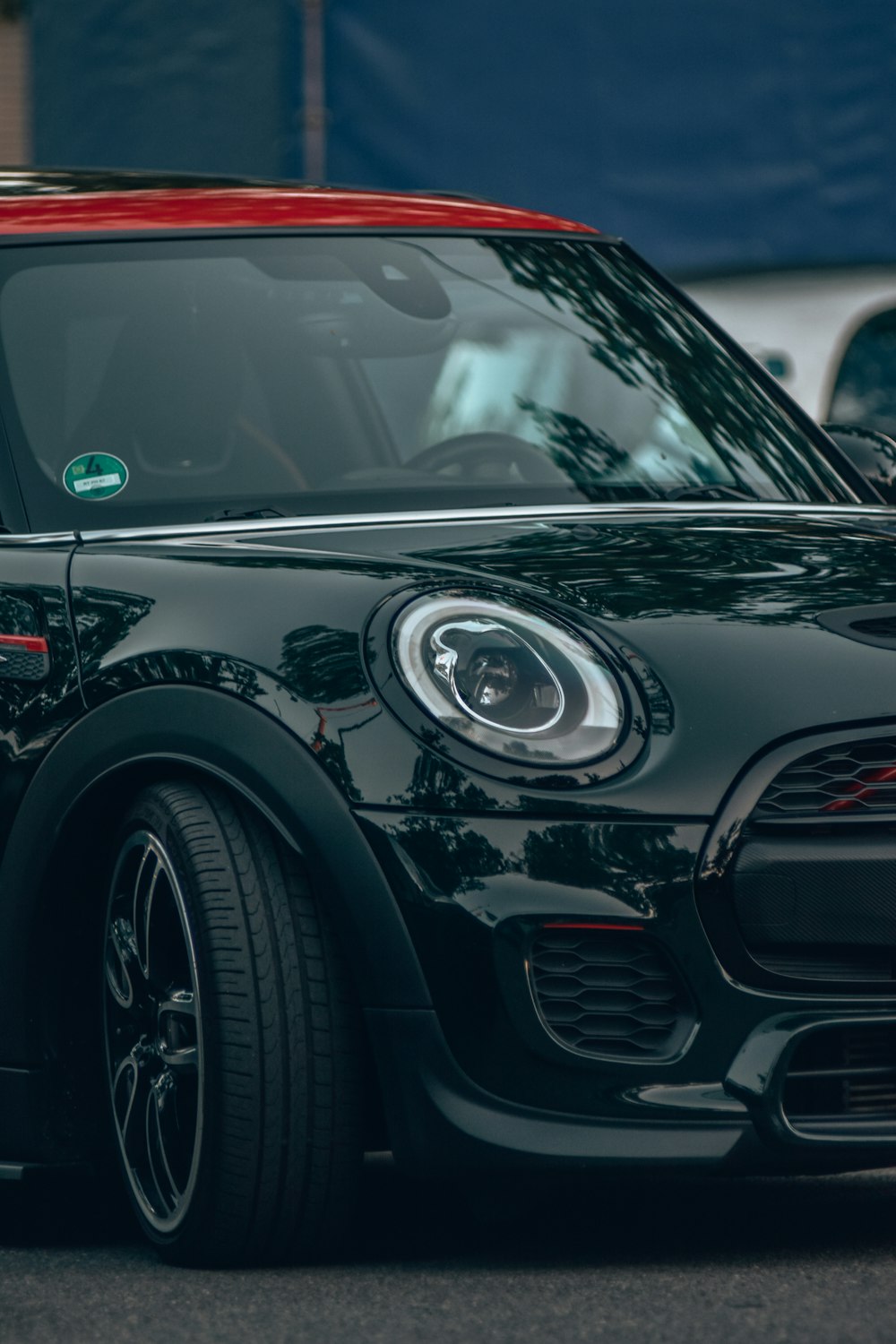 a black car with a red stripe