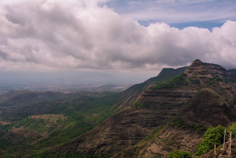 a valley with hills and clouds