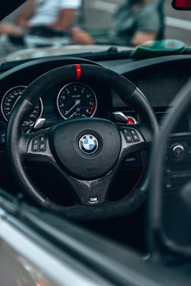 a steering wheel and dashboard of a car