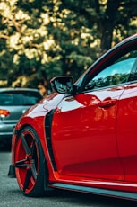 a red car parked in a parking lot