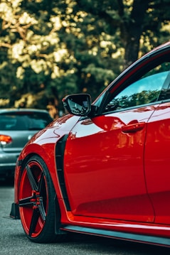 a red car parked in a parking lot