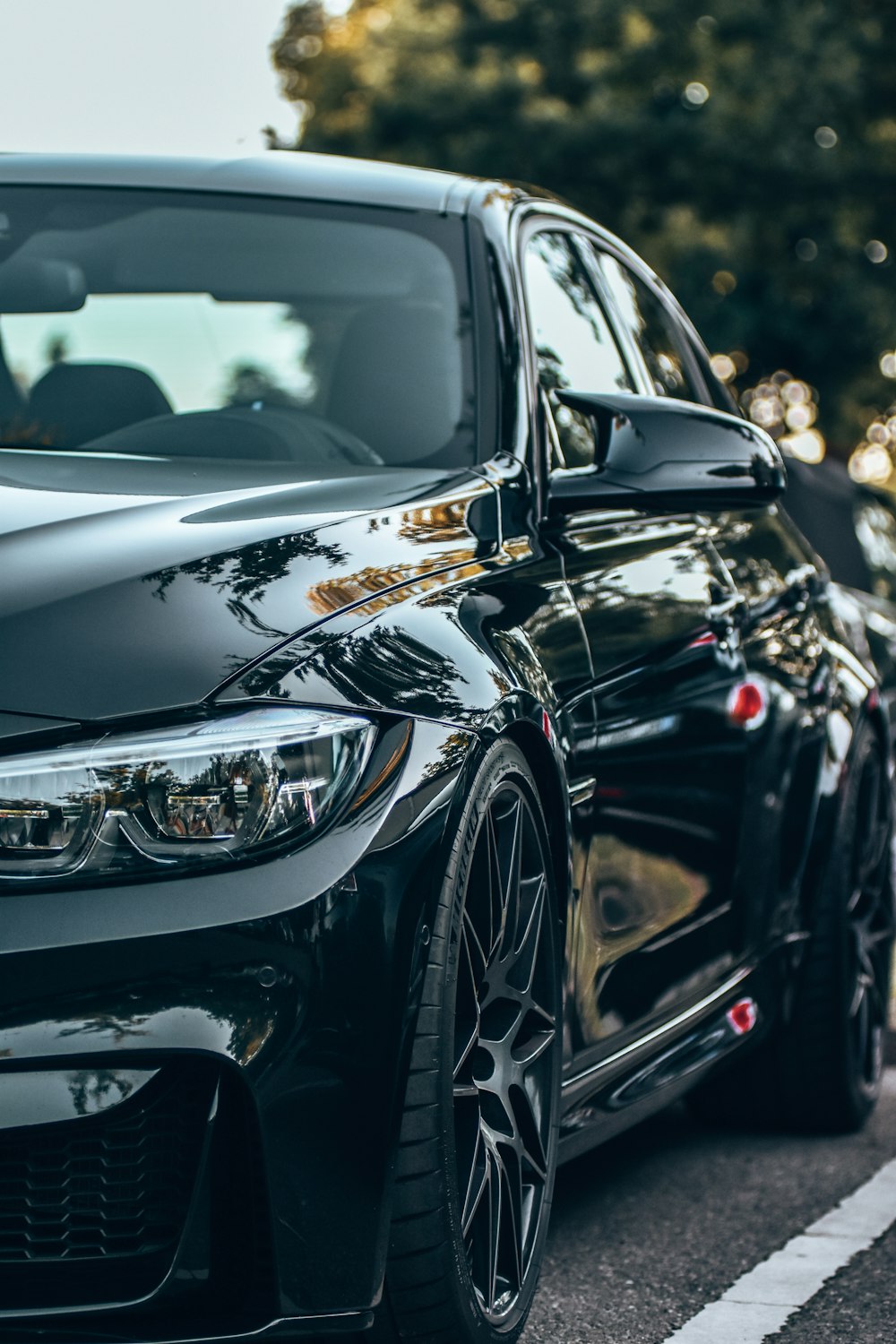 a black car parked in a parking lot