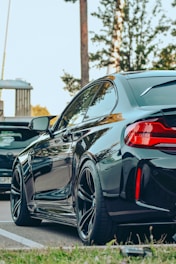 a black car parked on the side of the road