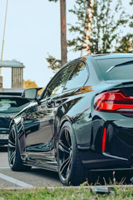 a black car parked on the side of the road