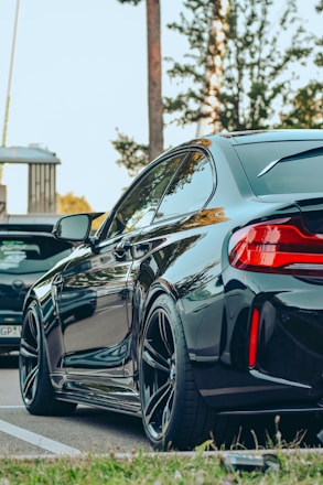 a black car parked on the side of the road