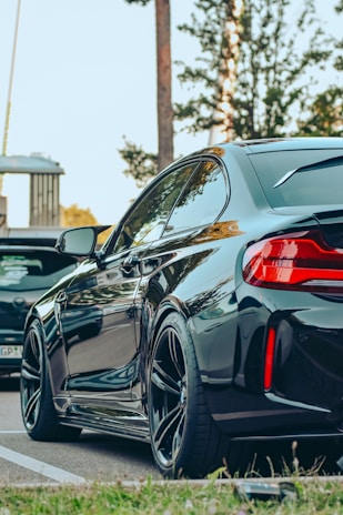 a black car parked on the side of the road
