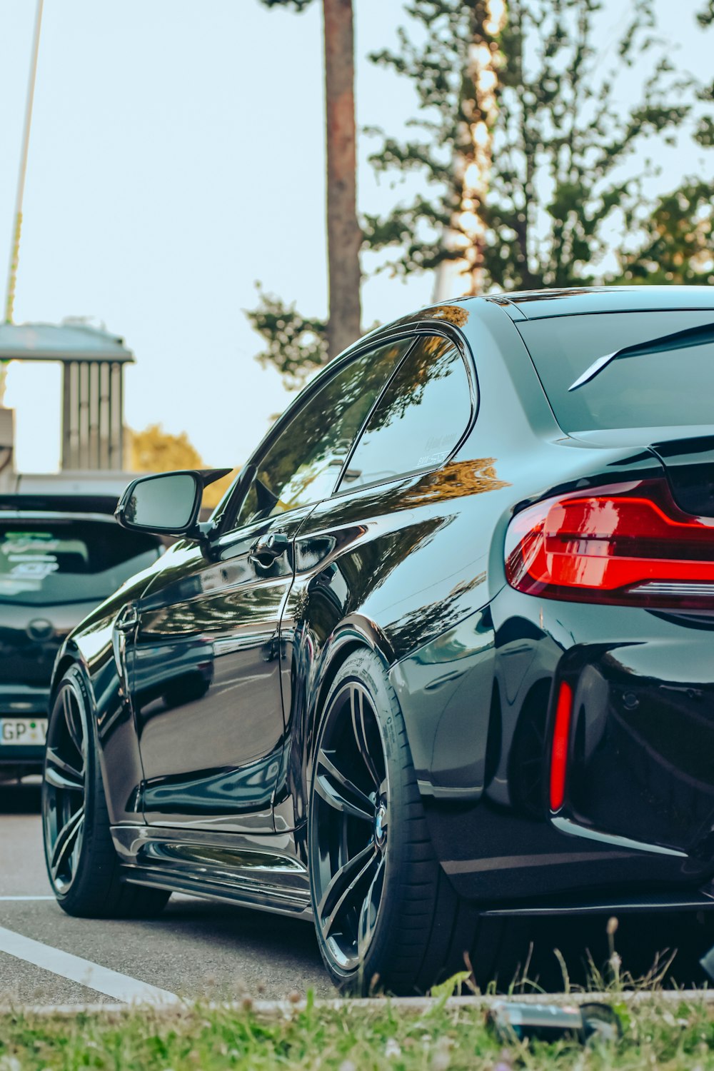 a black car parked on the side of the road