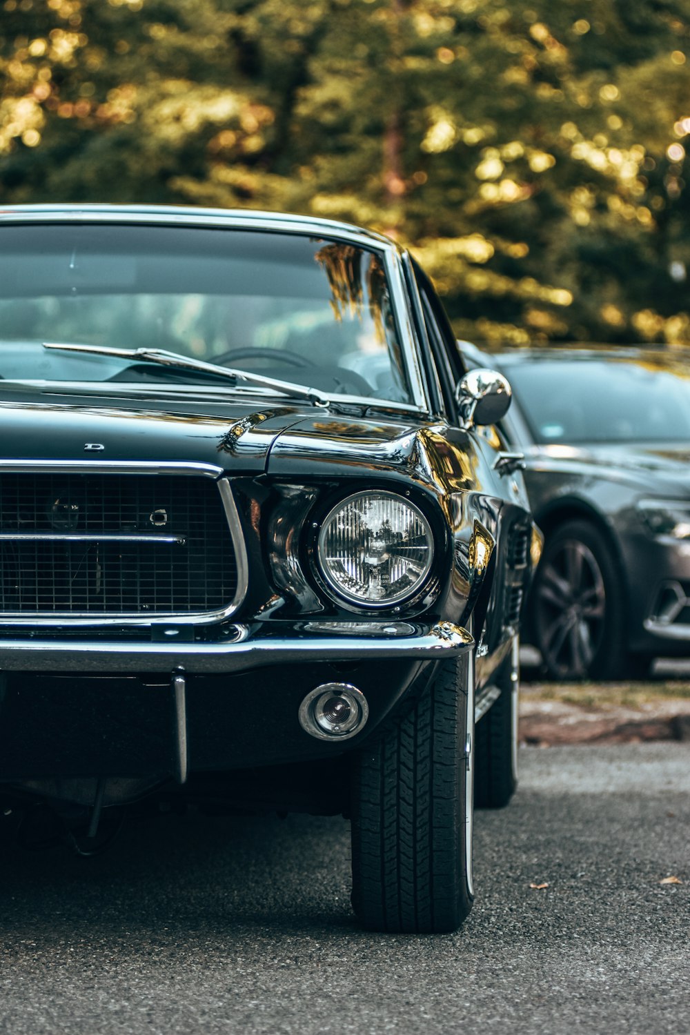 a black car parked in a parking lot