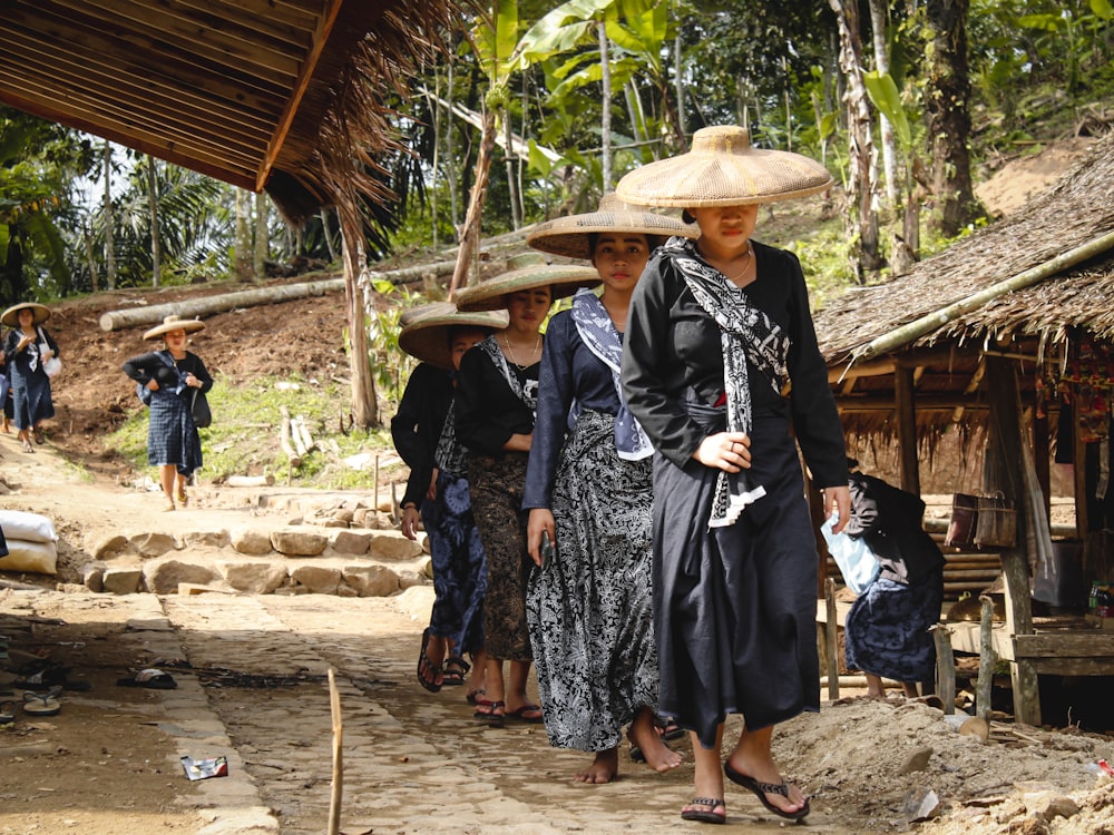 a group of women wearing hats