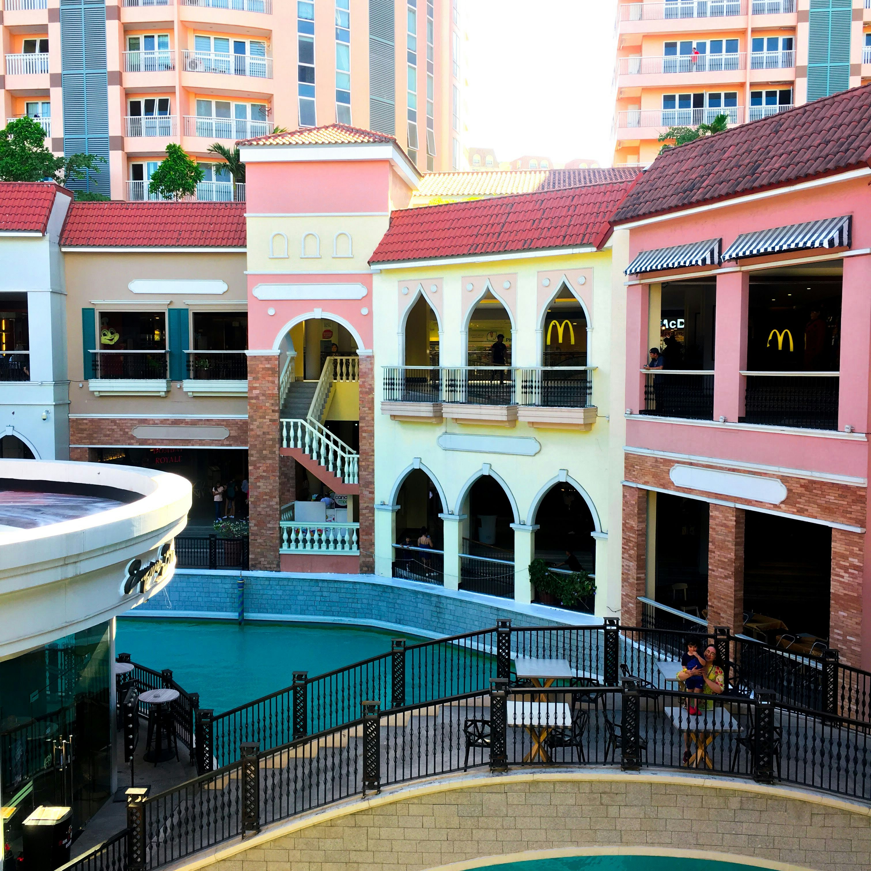 a group of buildings with a boat in the front
