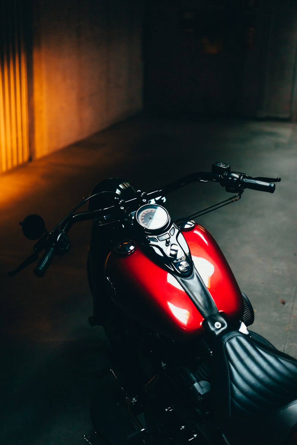 a motorcycle parked in a dark room