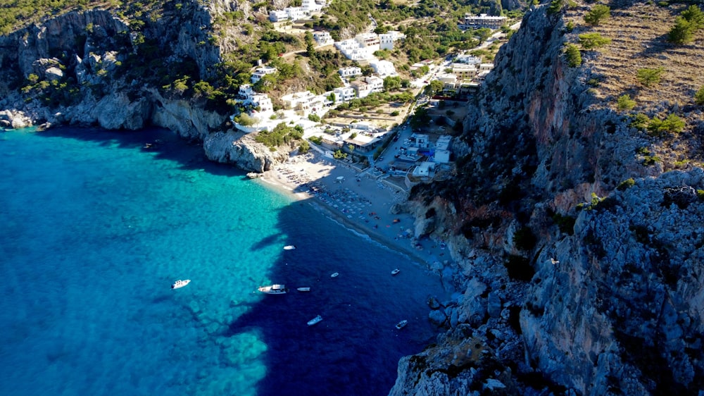 a rocky beach with boats