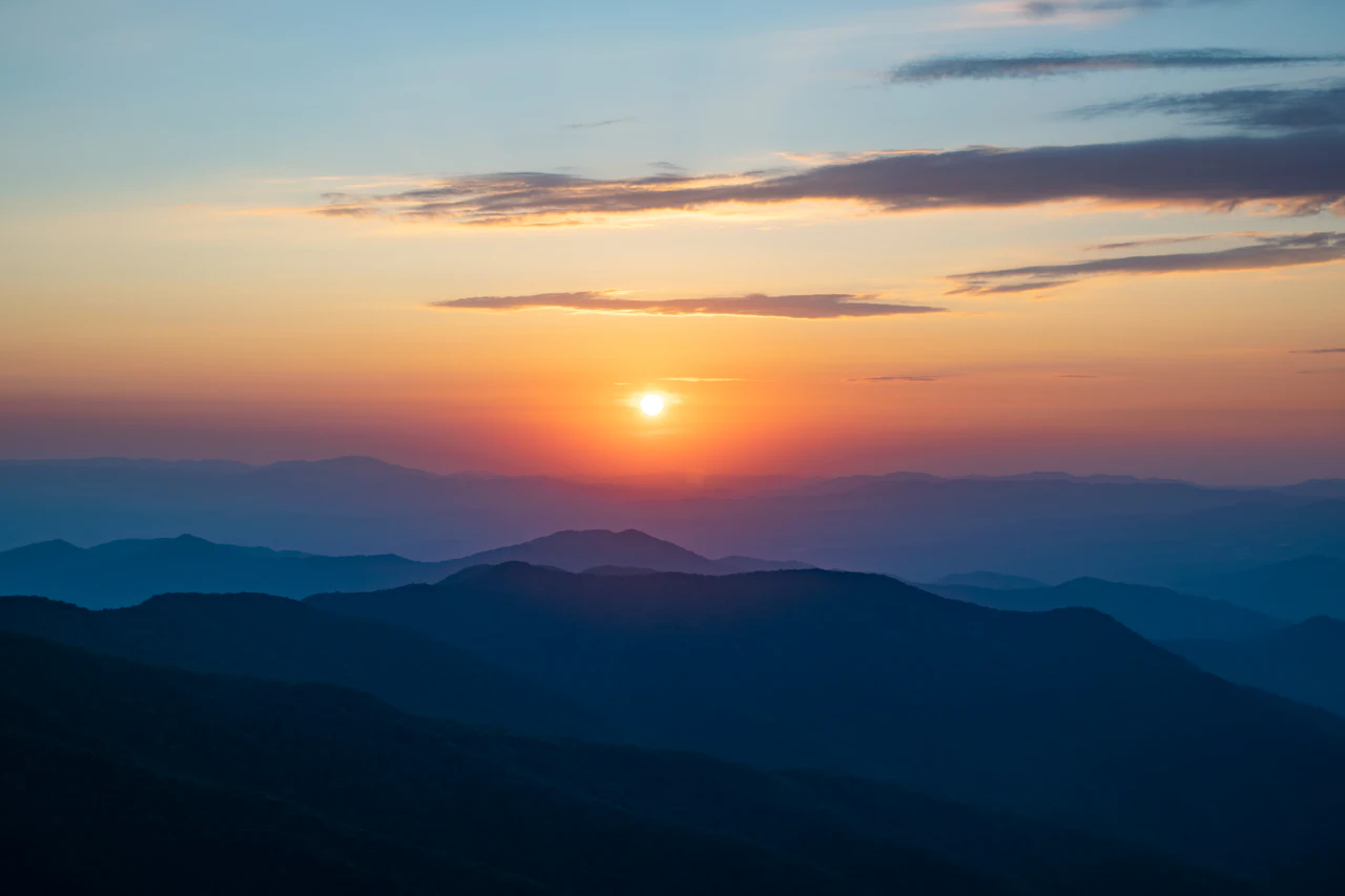 Sunset over layered Blue Ridge mountain ridges