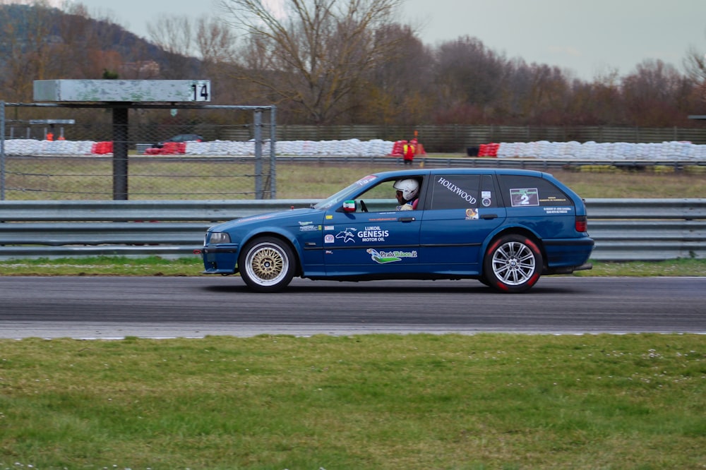 a blue car on a race track