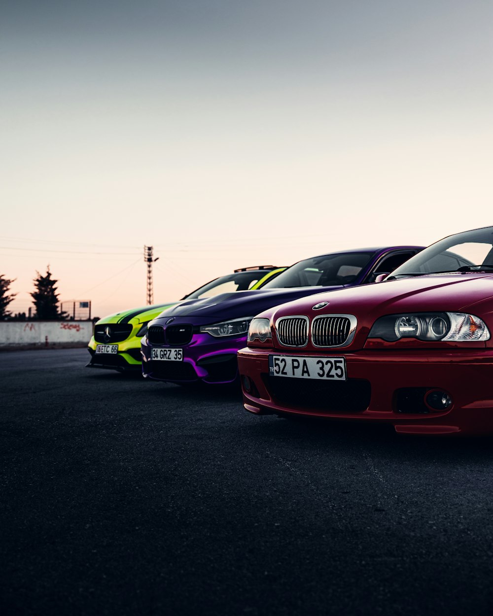 a group of cars parked in a parking lot