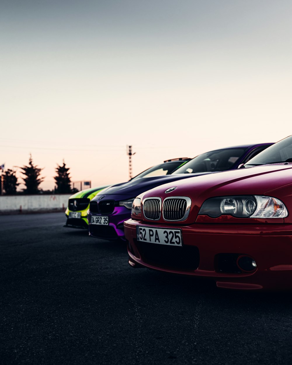 a row of cars parked on a road