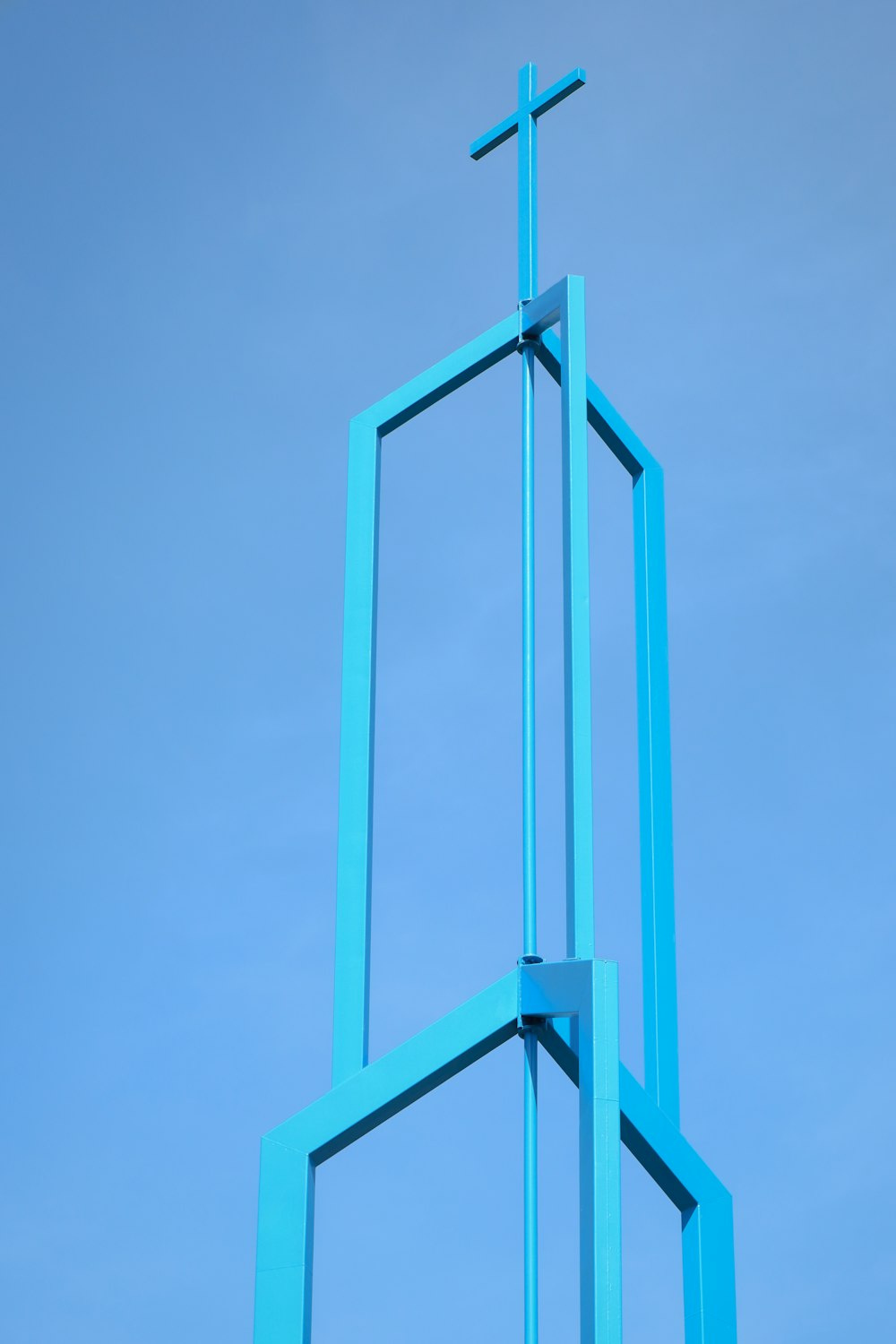 a blue rectangular object with a cross on top