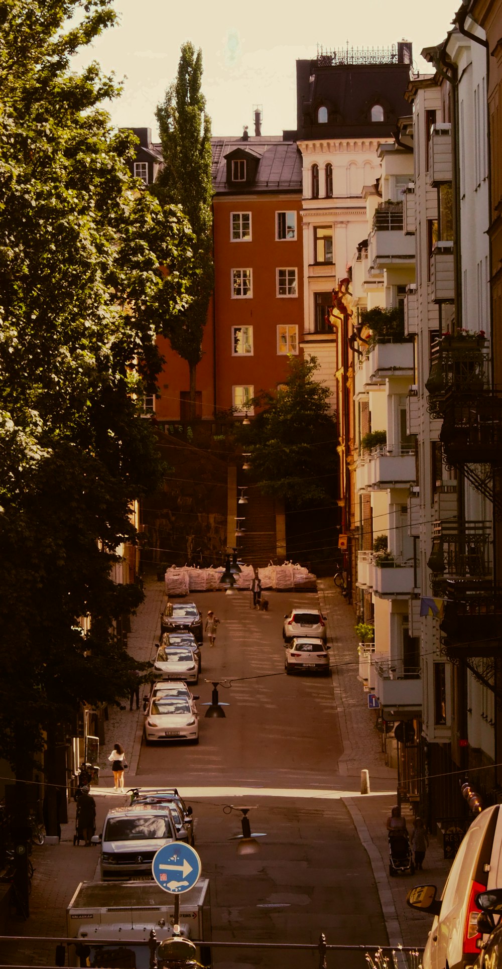 a street with cars and people