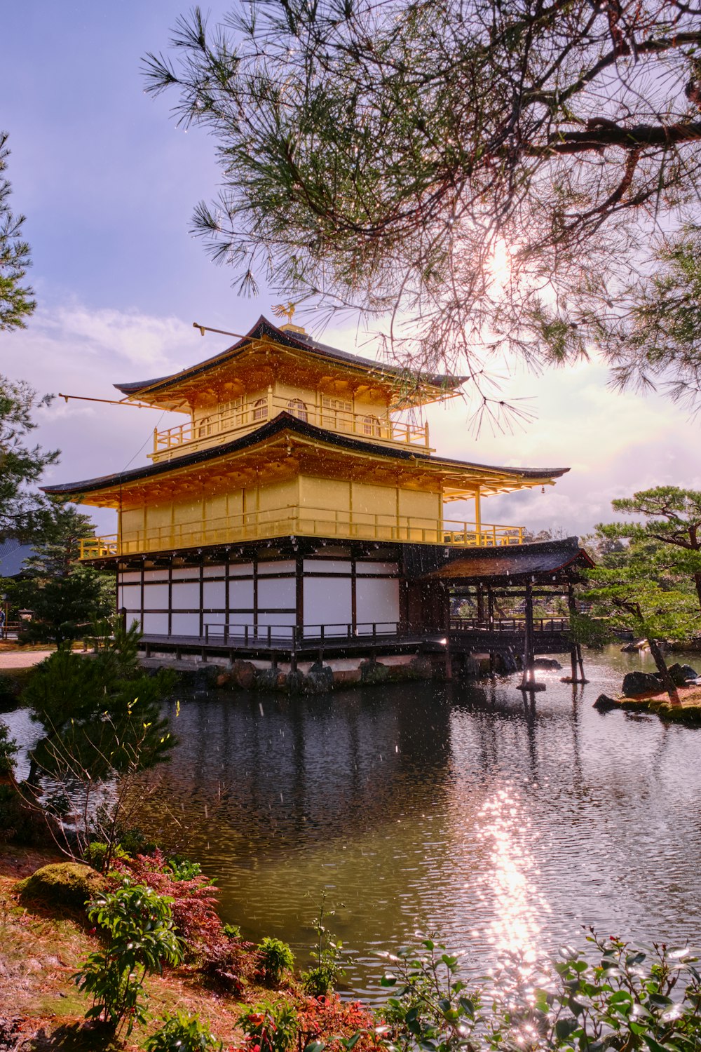 Kinkaku-ji with a large pond in front of it